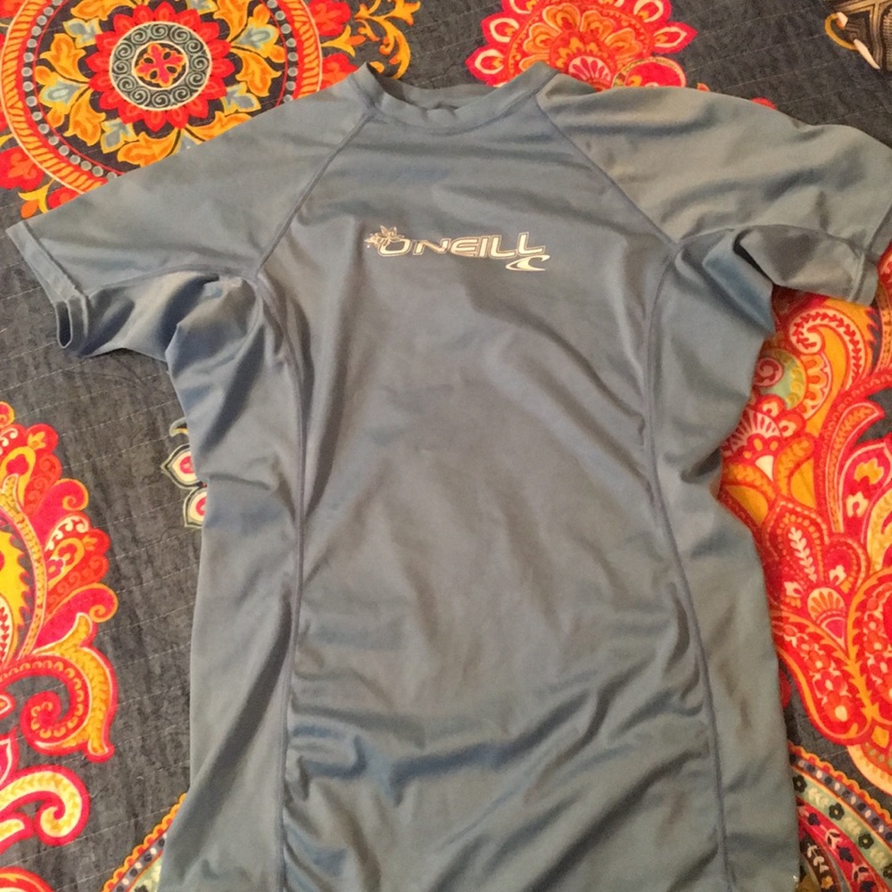 Light blue O'Neil rash guard.